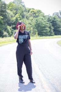 black tee, overalls and combat boots