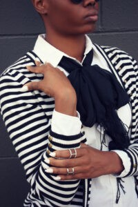 Striped cardigan with thin, black scarf