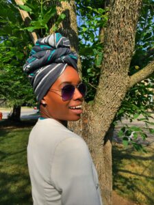 grey headwrap with white blazer