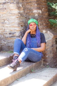 neon green headwrap with blue overalls