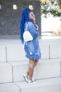 oversized denim jacket with white and metallic accessories