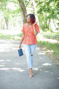 wrapped blouse with ripped denim jeans